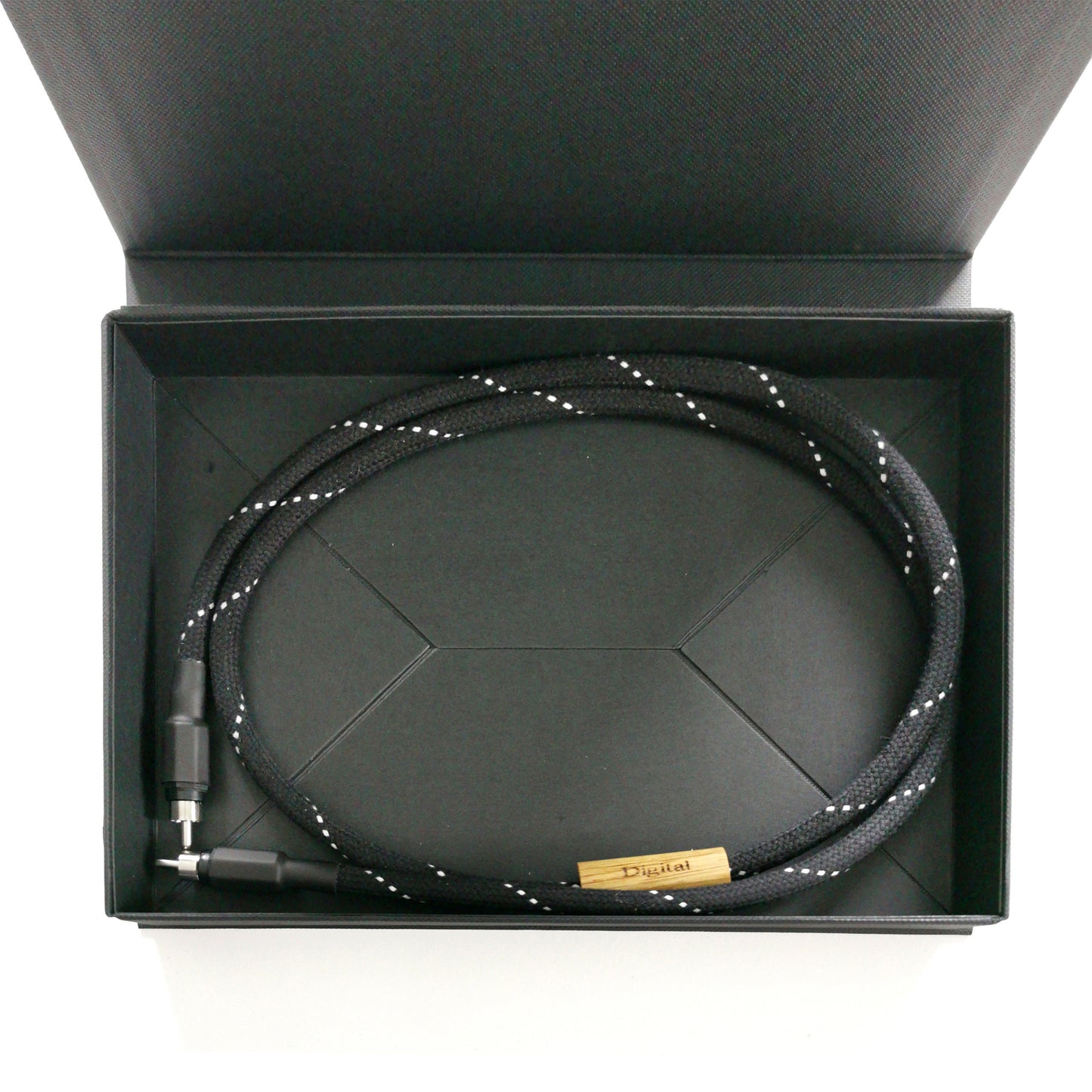 Entreq Primer Hexa Digital Signal Cable coiled on neutral background