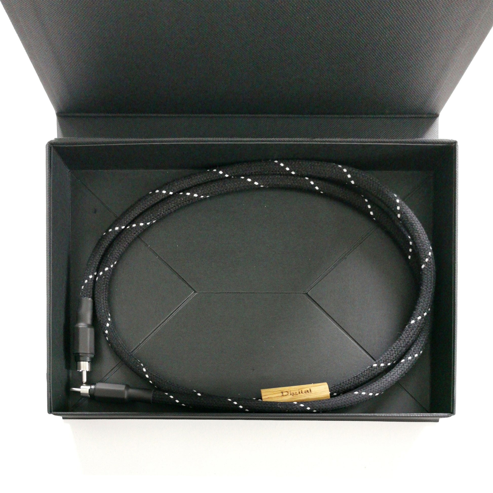 Entreq Primer Hexa Digital Signal Cable coiled on neutral background