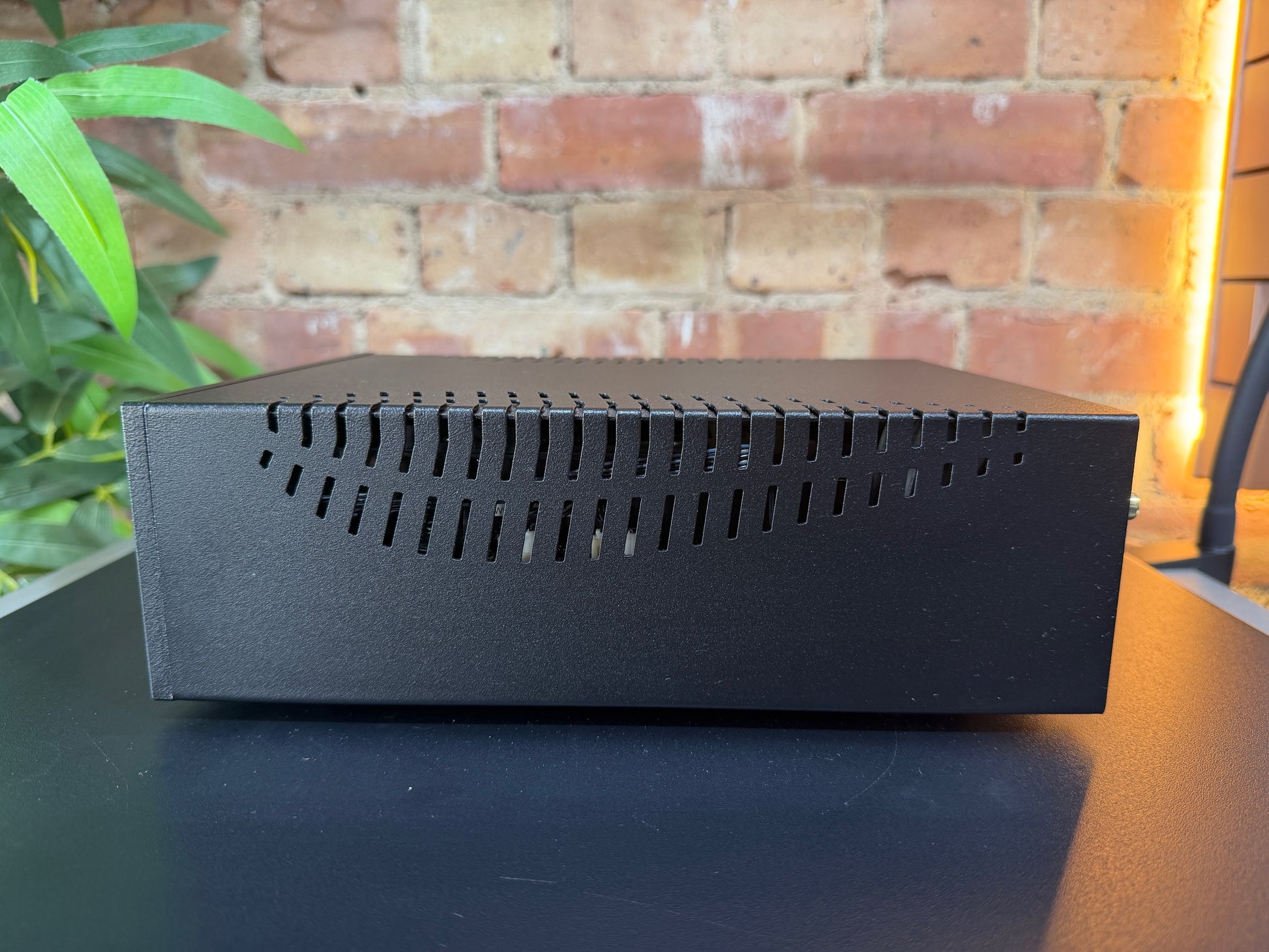 Side view of the Ex-Demonstration Gold Note CD5 showing the vent gaps on the side of the unit